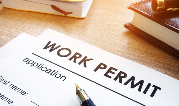 Work permit application on a table.